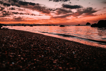 sun burning over the water, horizontal scenery 
