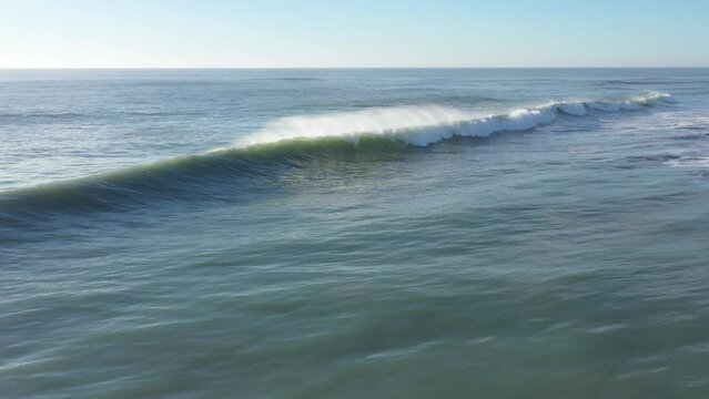 Drone footage of Atlantic waves in south Spain breaking next to the beach in El Palmar, Cadiz