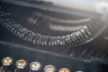 Close-up of metal parts of old typewriters. Old typewriter keys, Vintage old aged black. Retro style filtered photo.