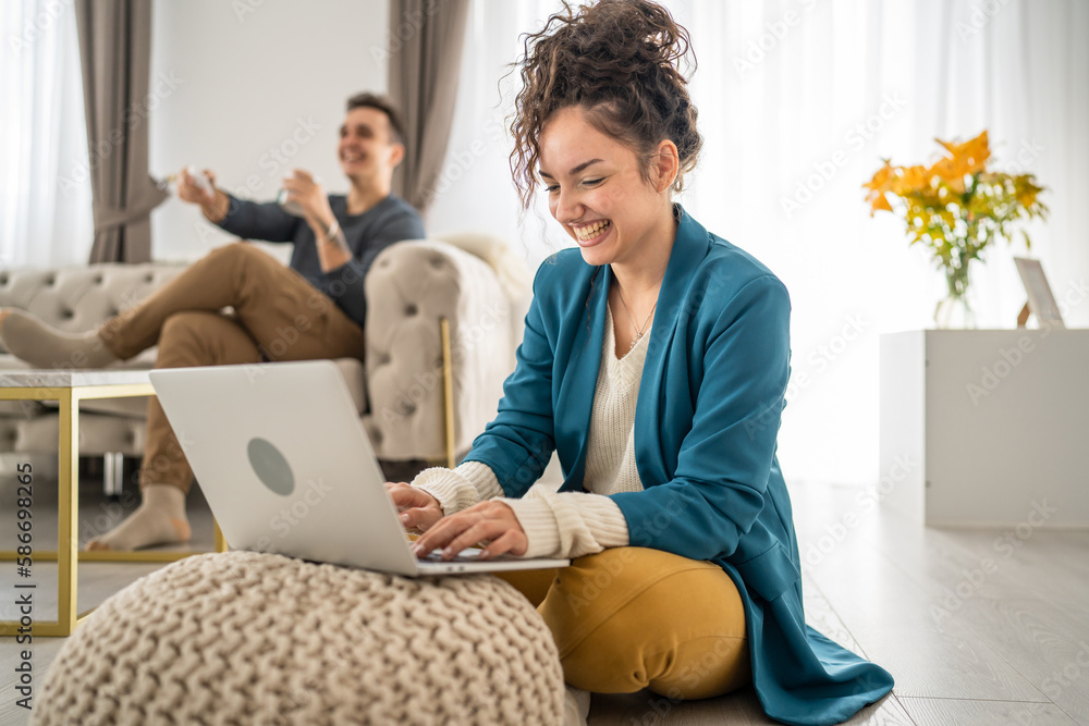 Wall mural woman use laptop computer at home family work leisure concept