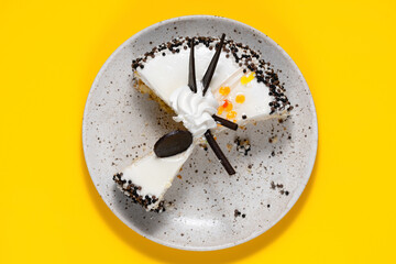 Delicious cake onon plate. Lunch at work. Copy space. Top view. Yellow background