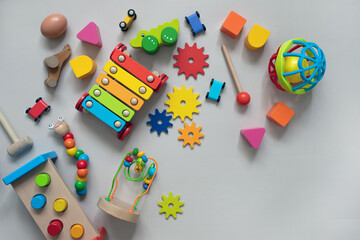 top view of bright children's wooden and plastic montessori toys for early development