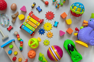 top view of bright children's wooden and plastic montessori toys for early development