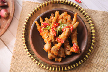 Ceker mercon or claw fireworks a food made from chicken claws cooked with chilies, onions and...