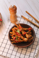 Ceker mercon or claw fireworks a food made from chicken claws cooked with chilies, onions and...