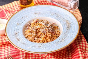 details of delicious carbonara pasta with black pepper