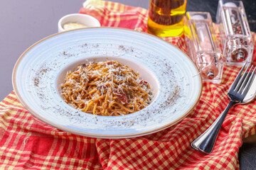 details of delicious carbonara pasta with black pepper