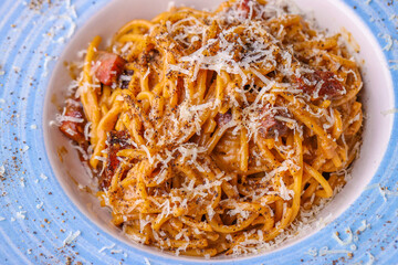 details of delicious carbonara pasta with black pepper