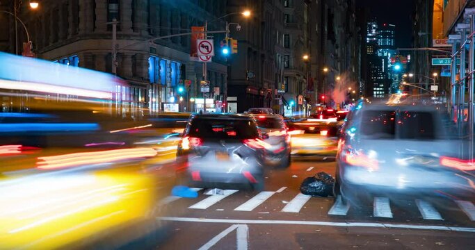 Lockdown Time Lapse Shot Of Cars Moving On Illuminated Street In City At Night - New York City, New York