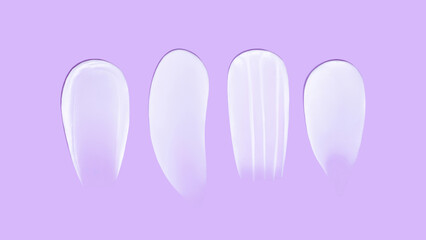 Set of smears of cream texture on blue background