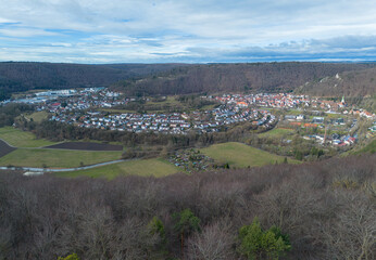Naklejka premium Drone recording of the city of Blaubeuren in winter when the sun is shining.