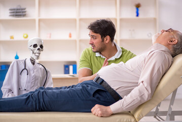 Old male patient visiting skeleton doctor