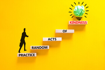 Practice random kind of kindness symbol. Concept words Practice random kind of kindness on wooden block. Beautiful yellow background. Businessman icon. Business practice kindness concept. Copy space.