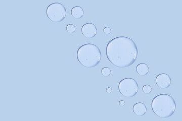 set of drops of gel texture on a blue background