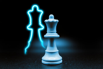 cyan blue queen with led in the shape of queen. close up photo with black background. chess piece illustration, creative, promotion