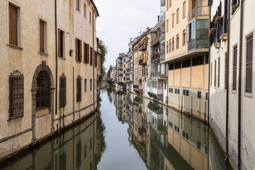 Beautiful urban view of one of the canals between River Brenta and Bacchiglione from Ponte delle...