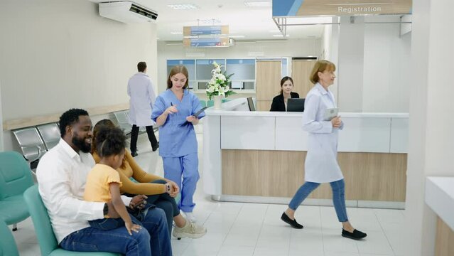 Diversity in hospital lobby or hallway with busy nurse, older patient on wheelchair, sick patient, relative waiting at reception 
