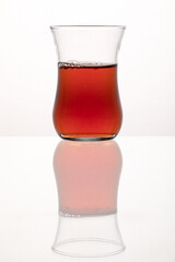 Traditional Turkish tea glass with tea.