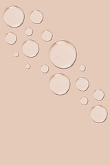 set of drops of gel texture on a pink background