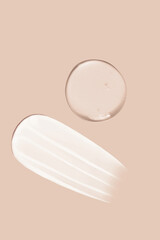 Cream smear texture and transparent gel smear texture on beige background