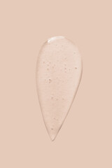 texture of a large smear of transparent gel on a beige background