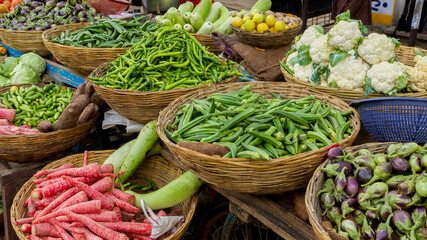 vegetables in a market in india in baskets