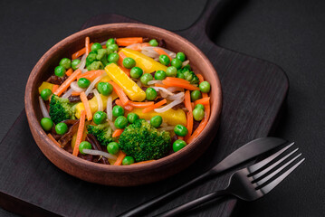 Delicious steamed vegetables broccoli, mushrooms, peas, carrots and onions