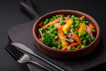 Delicious steamed vegetables broccoli, mushrooms, peas, carrots and onions
