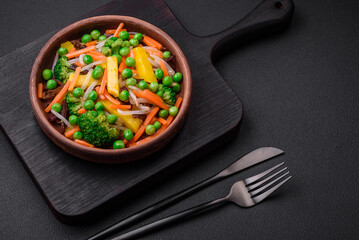Delicious steamed vegetables broccoli, mushrooms, peas, carrots and onions