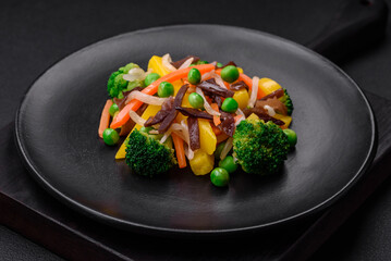 Delicious steamed vegetables broccoli, mushrooms, peas, carrots and onions