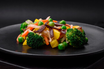 Delicious steamed vegetables broccoli, mushrooms, peas, carrots and onions