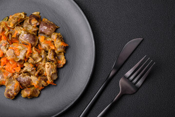 Delicious stewed chicken gizzards with carrots and tomato