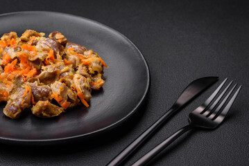 Delicious stewed chicken gizzards with carrots and tomato