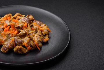 Delicious stewed chicken gizzards with carrots and tomato