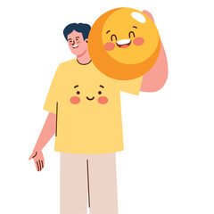 Smiling boy holds emoticon joyful