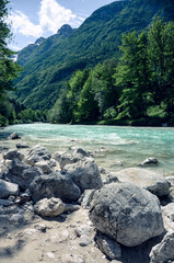 Beautiful blue apline river Soca, popular outdoor destination, Bovec, Soca Valley, Slovenia, Europe.