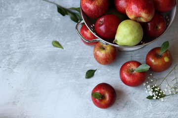 Beautiful shiny red apples on a table. Still life with organic fruit. Healthy eating concept. 