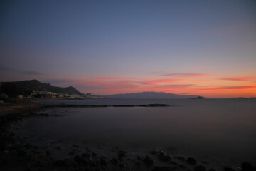 sunset on the beach. Seaside town of Turgutreis and spectacular sunsets. Selective Focus.  Long Exposure shoot. tranquility scene.