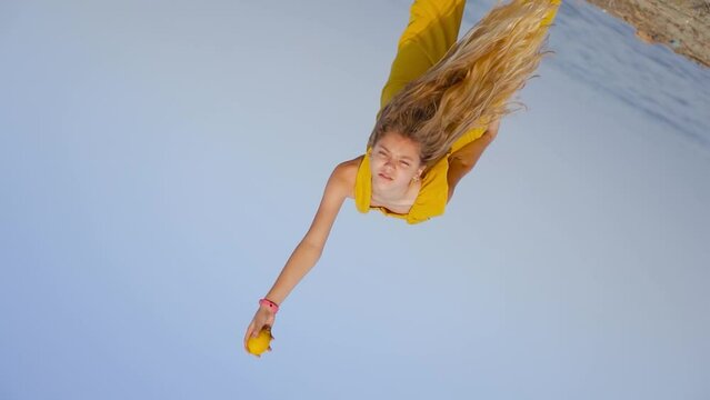 Flexible and bent over girl drops a lemon