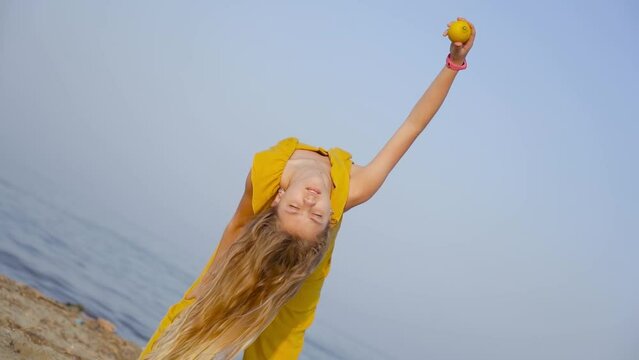 Flexible and bent over girl drops a lemon