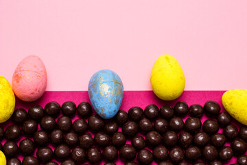 Chocolate and Easter Eggs on color Background. Happy Easter