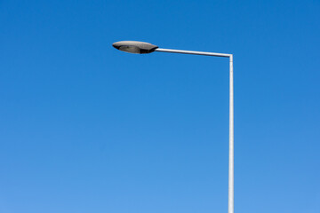 Street lamp on a pole against a beautiful sky