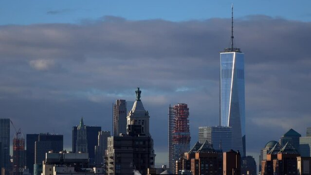 Lockdown Shot Of World Trade Center And Skyscrapers Against Cloudy Sky During Sunset - New York City, New York