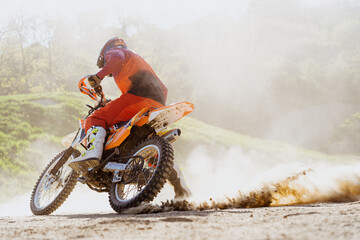 Man riding motorbike on motocross track.Extreme and Adrenaline. Motocross rider in action....