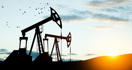 The change in oil prices caused by the war. Oil price cap concept. Oil drilling derricks at desert...
