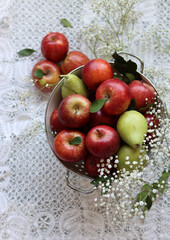 Naklejka na ściany i meble Still life with beautiful red apples on a table. Juicy summer fruit close up photo. Eating fresh concept. 