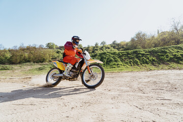 Man riding motorbike on motocross track.Extreme and Adrenaline. Motocross rider in action. Motocross sport. Active lifestyle