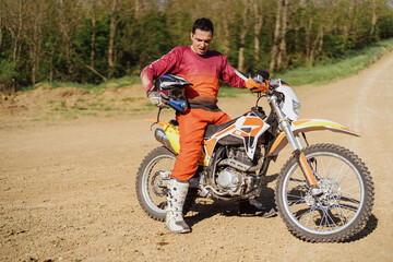 Obraz na płótnie Canvas Extreme and Adrenaline. Motocross rider close up portrait. Motocross sport. Active lifestyle.