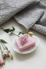 top view of natural decorated homemade soap with flowers on white surface. spa organic soap. Natural vegan soap with rose fragrance
