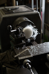 Work that cuts resin material with a lathe
